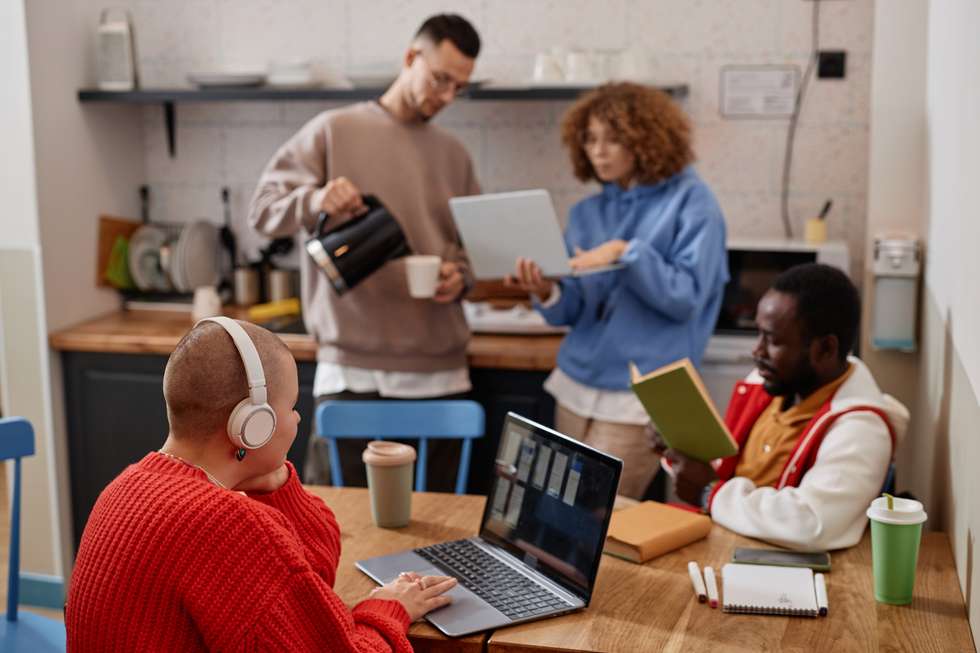 Students working in a common space in student housing