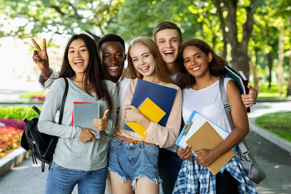 Students posing for a group photo on campus